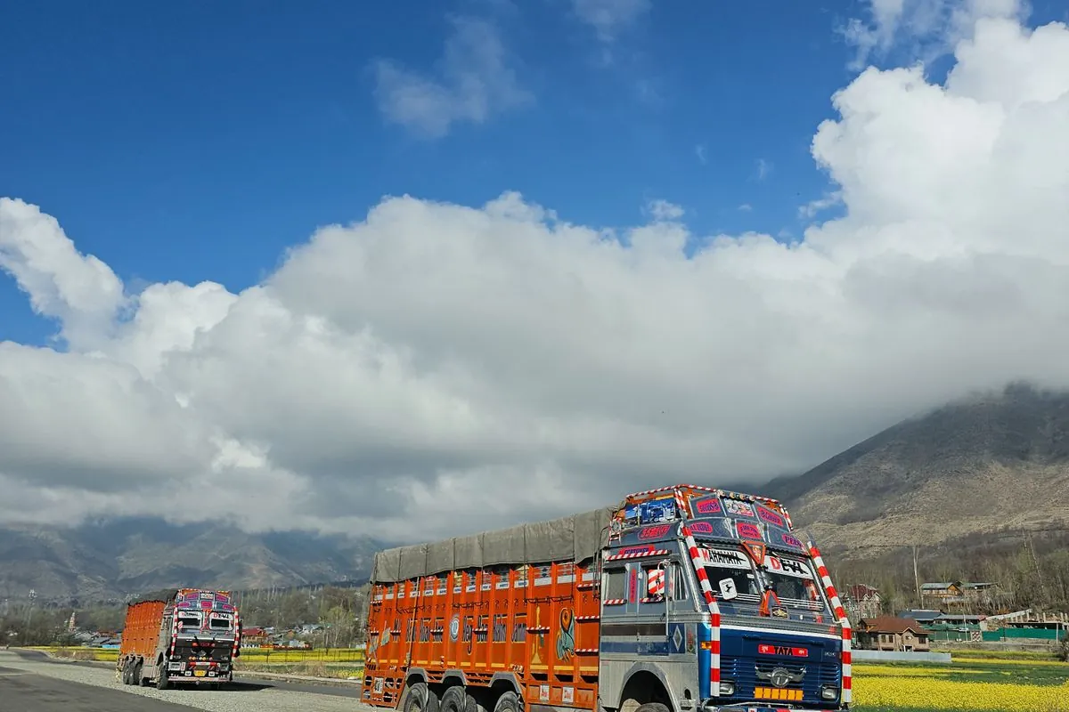 JK Express trucks on a mountain highway route
