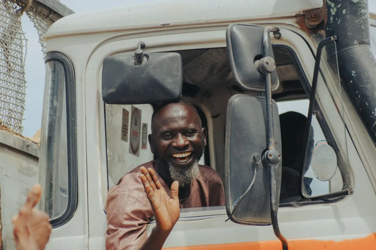 JK Express driver waving from the cab